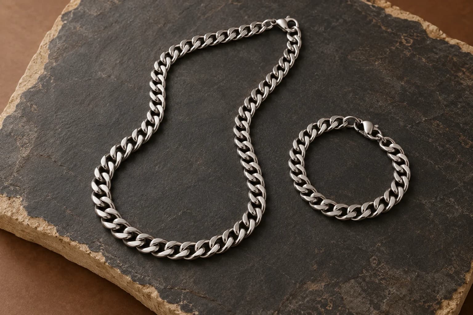 Product category: Silver-tone chain necklace and bracelet on dark stone